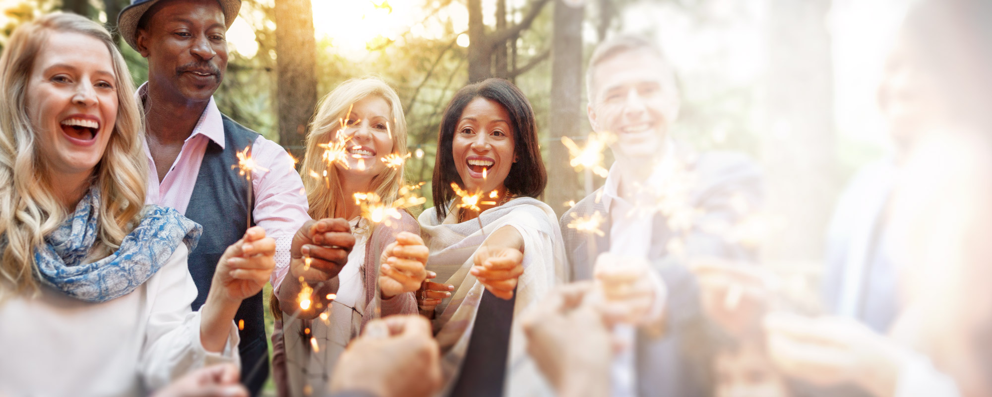 Smiling people with sparklers